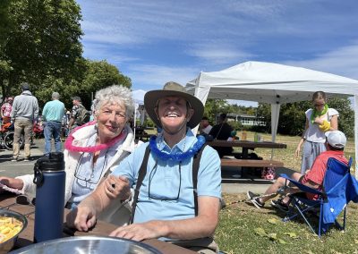 A man and a woman smiling at the Victoria Stroke Recovery Association (VSRA) picnic, July 2025