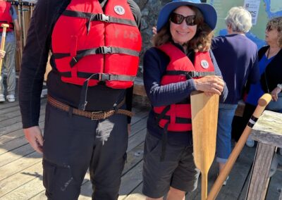 Two VSRA members in their life jackets, paddles ready for the dragon boat!