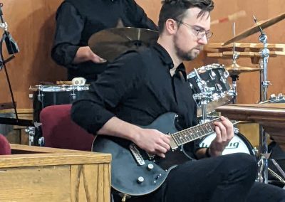 Two men playing drums and guitar on Jazz Night