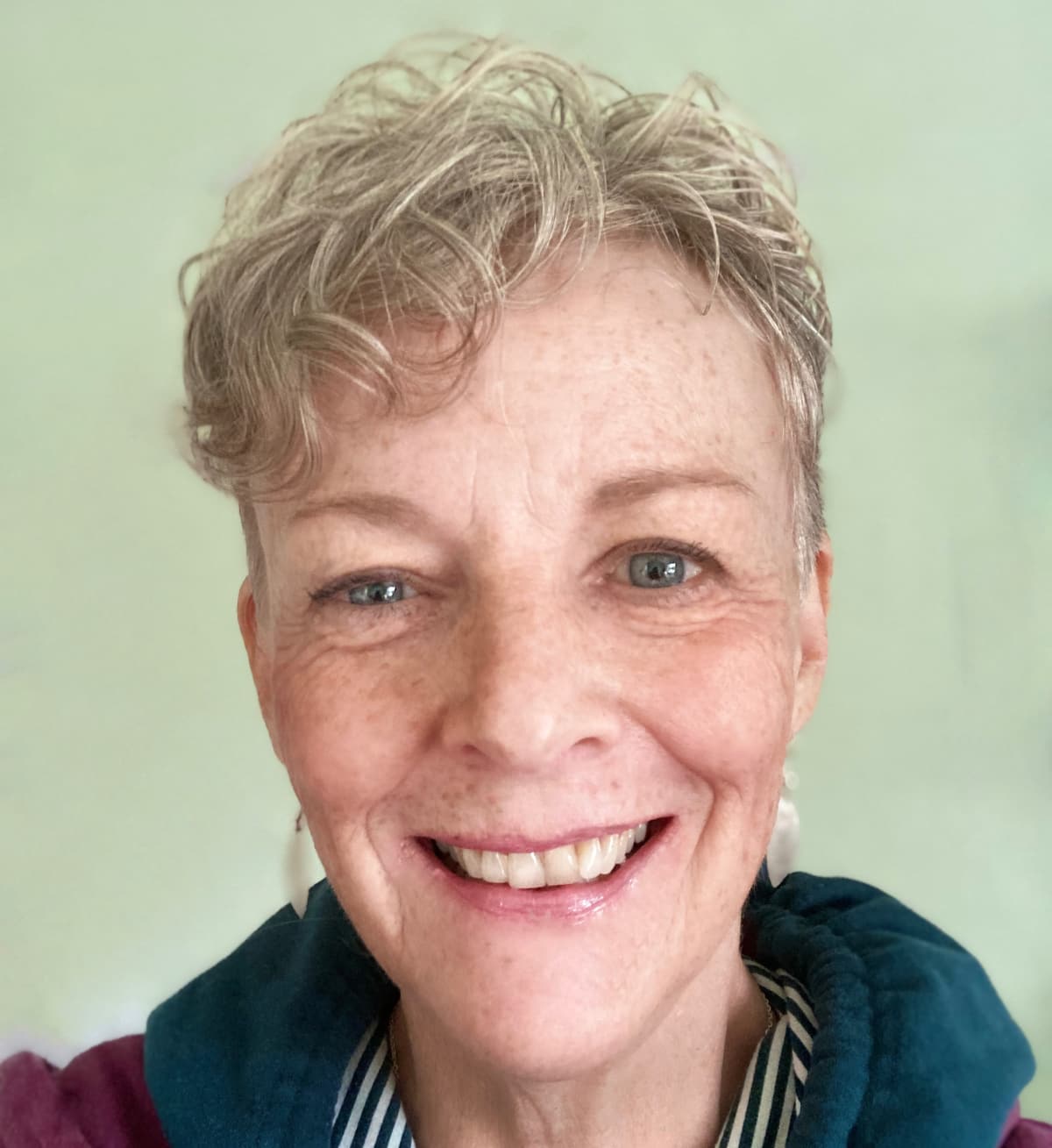 A gently smiling woman